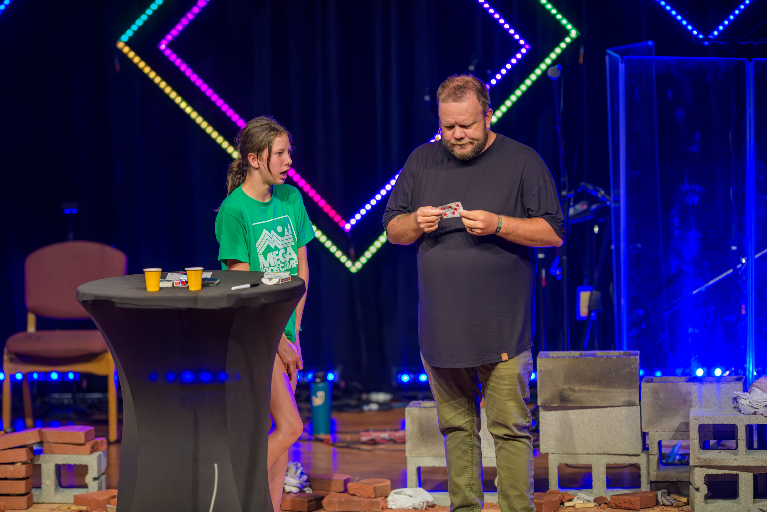 David Wood performing with an audience volunteer